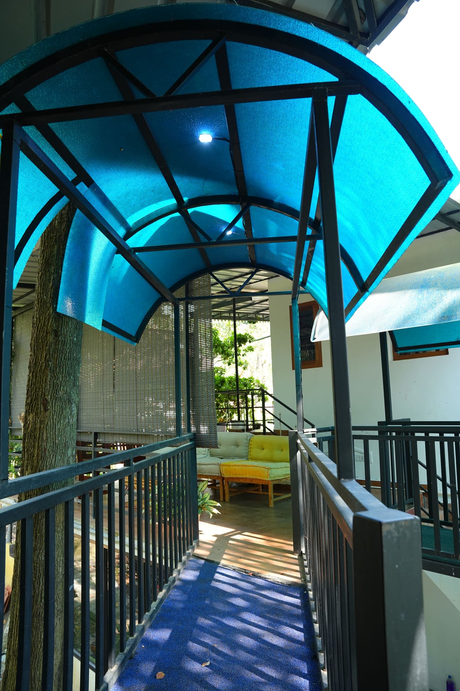 Blue Circular Portal — Kaivalyam Homestay, Padichira, Wayanad