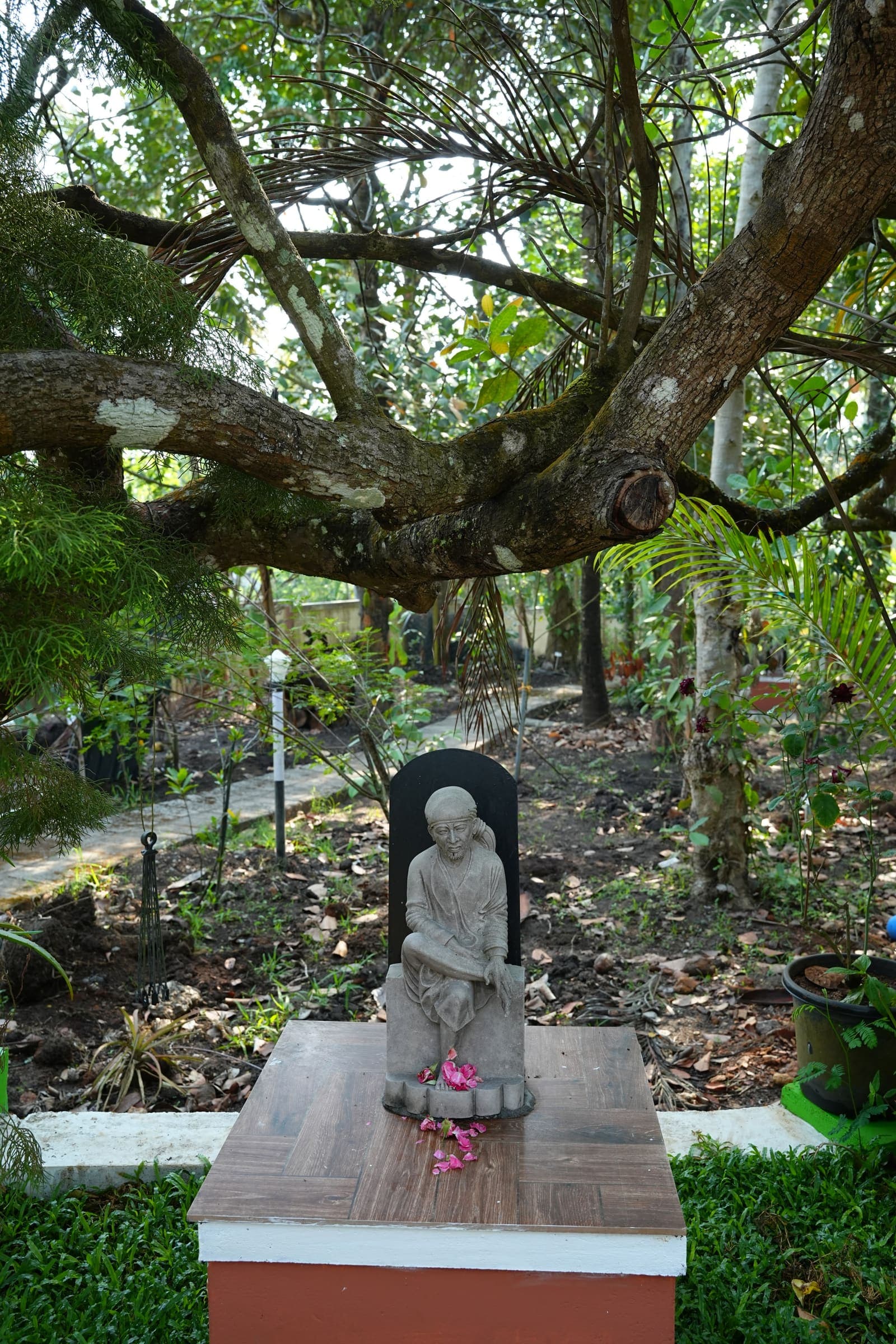 Stone Idol Under Tree — Kaivalyam Homestay, Padichira, Wayanad