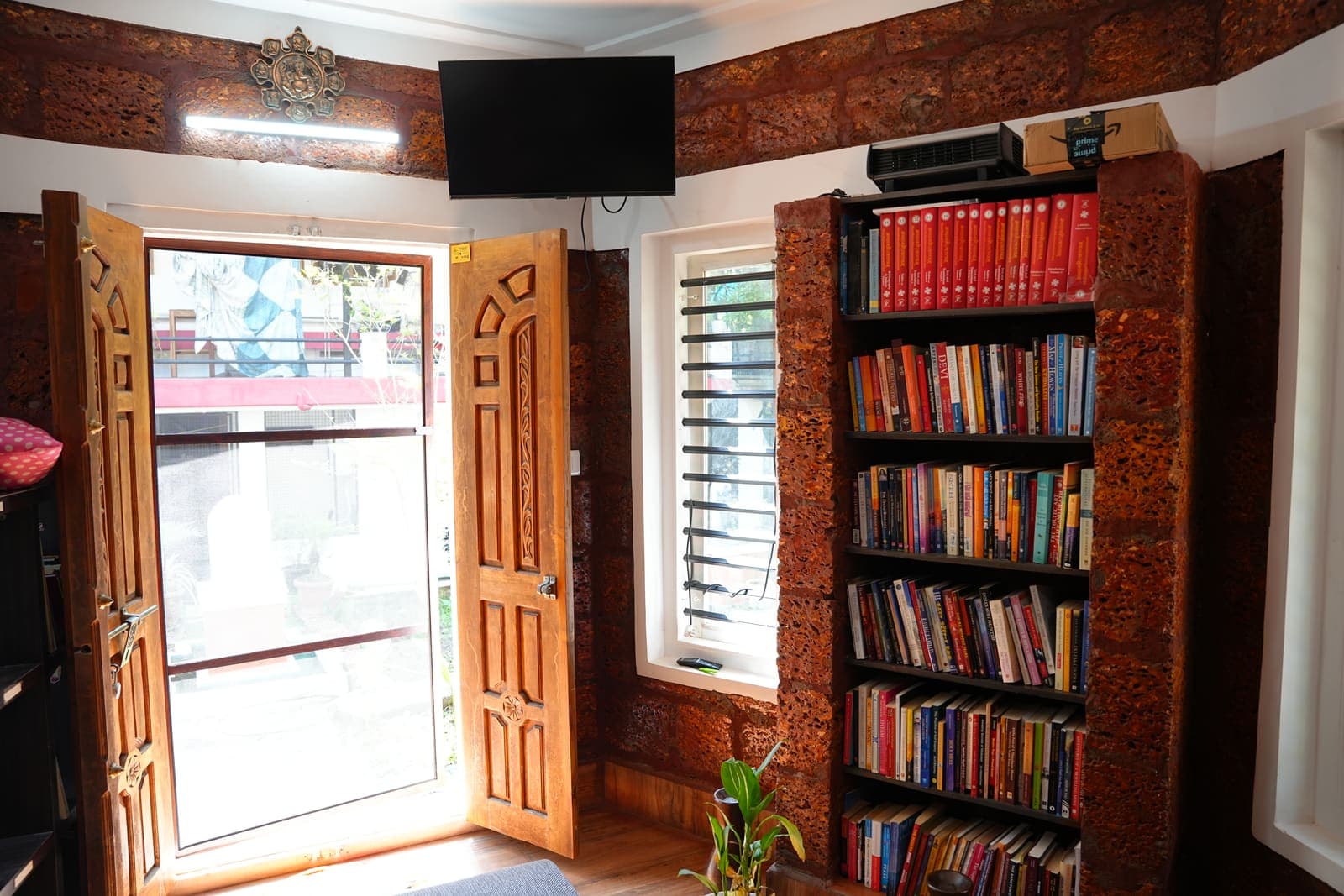 Bookshelves Warm Wood — Kaivalyam Homestay, Padichira, Wayanad
